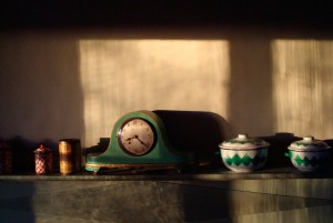 Old clock and ornaments on a shelf